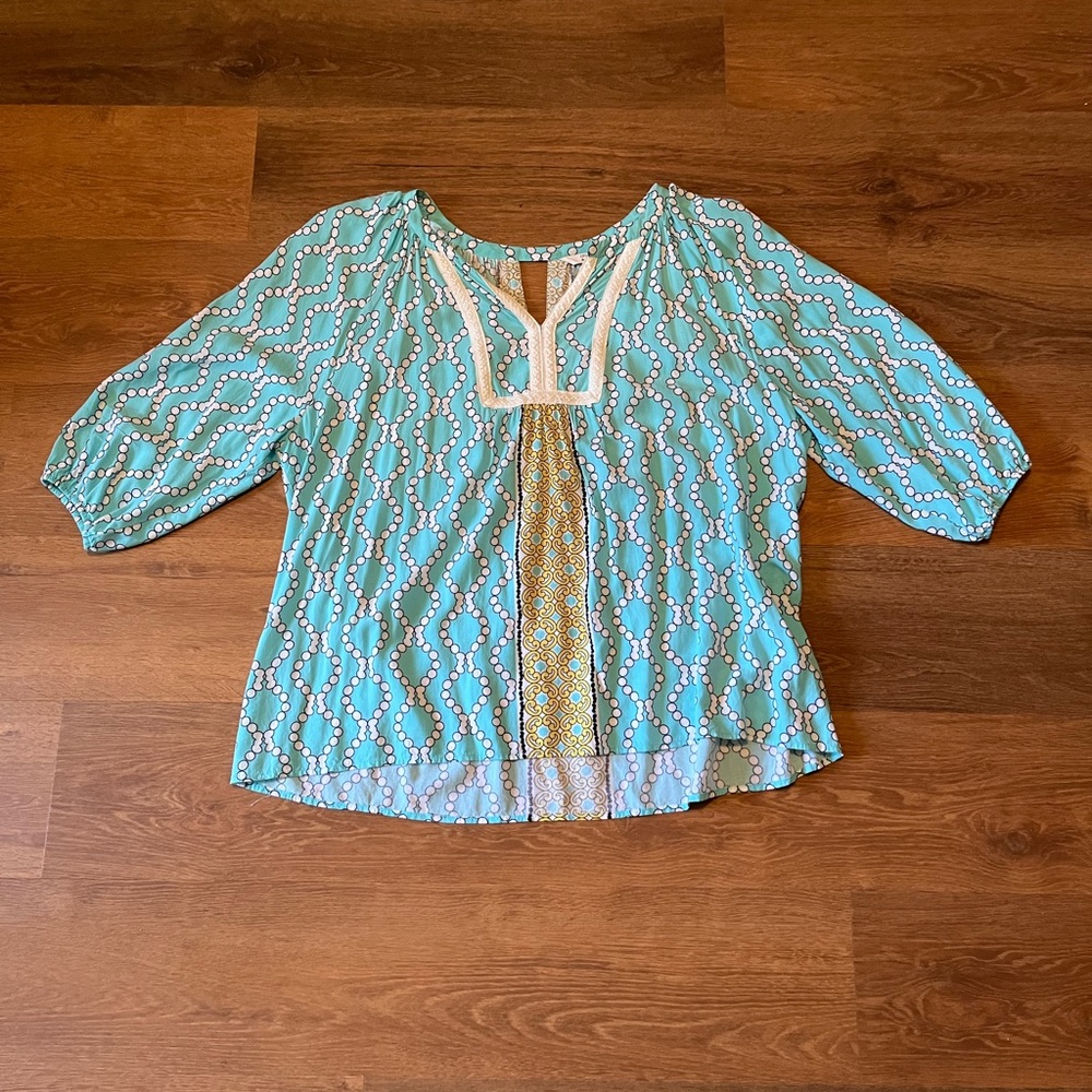 White and Blue colored blouse.